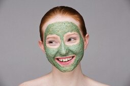 A young woman with a green face mask