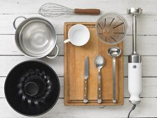 Kitchen utensils for making semolina pudding with berry sauce