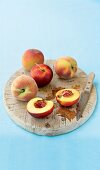 Peaches on a wooden chopping board