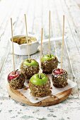 Toffee apples with sesame seeds, sunflower seeds and poppy seeds