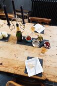 View down onto antipasti on rustic wooden table