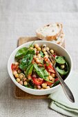 Chickpea salad with peppers and baby spinach