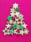Colourful Christmas star biscuits in the shape of a Christmas tree
