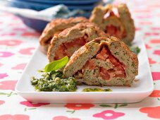 Spicy sponge roulade with tomatoes and pesto