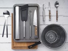 Kitchen utensils for preparing seared duck breast with salad