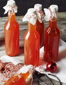 Bottles of homemade quince syrup