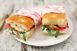 Focaccia sandwiches with tomato, cheese, rocket and turkey breast