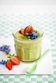 Vegan overnight oats with matcha, coconut milk, chia seeds and berries