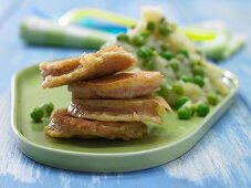 Pan-fried sausage slices with pea & potato purée