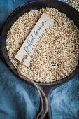 Puffed quinoa in a small dish (top view)