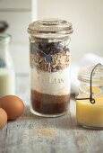 Layered ingredients for making cookies in a preserving jar as a gift
