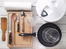 Assorted kitchen utensils for preparing salad
