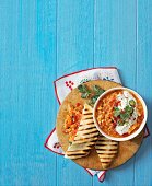 Chili baked beans with minced meat and stuffed pita bread with chicken and baked beans