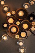 Candles in pots and glasses (top view)