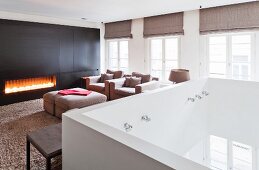 Gas fire in elegant lounge on gallery with white balustrade