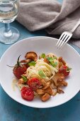 Tagliatelle with chanterelle mushrooms and cherry tomatoes