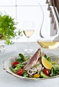 Salad with smoked trout, lemon and herbs