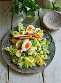 A summery potato & bean salad with chicken and egg