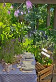 Set garden table decorated with lavender and snail shells