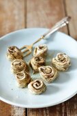 Herring rolls with herbs and black pepper
