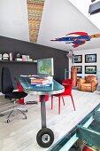 Designer desk on wheels on gallery with comic-book mural on ceiling
