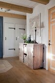 Cabinet made from upcycled wooden crates and baskets in hallway