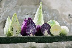 Assorted types of cabbage, whole and halved