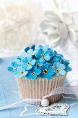 Cupcake decorated with sugar forget-me-nots