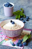 Porridge oats with cream and blueberries