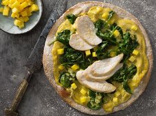 An Indian-style pizza with chicken and mango