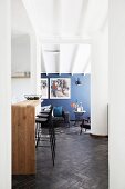 Kitchen counter, bar stools and retro lounge area