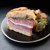 A muffuletta sandwich with olive tapenade