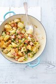 Potatoes fried with leek and sausage and served with horseradish sauce