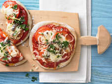 Tomato pizzas with anchovies and gremolata