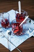 Glasses of cranberry drinks festively served on napkin