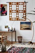 Wall hanging, retro standard lamp and desk in eclectic interior
