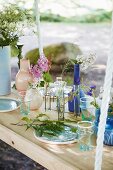 Flower arrangements on suspended table in garden