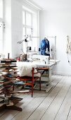 Industrial sewing machine in sewing studio with stylised Christmas tree made from reclaimed wooden boards