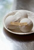 Christmas-tree baubles dipped in plaster in dish