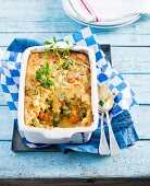 Chicken cobbler with chicken, carrots, leek and broad beans