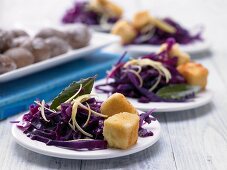 Breaded sheep cheese with lemon and red cabbage