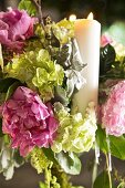 Arrangement of hydrangeas and candle