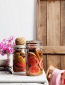 Spiced preserved guavas in a preserving jar