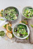 Green vegetable soup with pesto and bruschetta