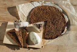 Ticino chestnut flour cake (castagnaccio) with rosemary, served with lard and ricotta