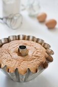 A freshly baked Bundt cake in a Bundt cake pan