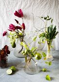 Flowering and fruiting branches and ornamental vegetables arranged in vases