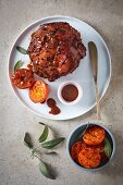 Studded baked ham with a toffee glaze and grilled clementines