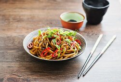 Udon noodles with peanut sauce and pea sprouts