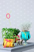 Plant pots with colourful felt covers as ornaments or as gifts